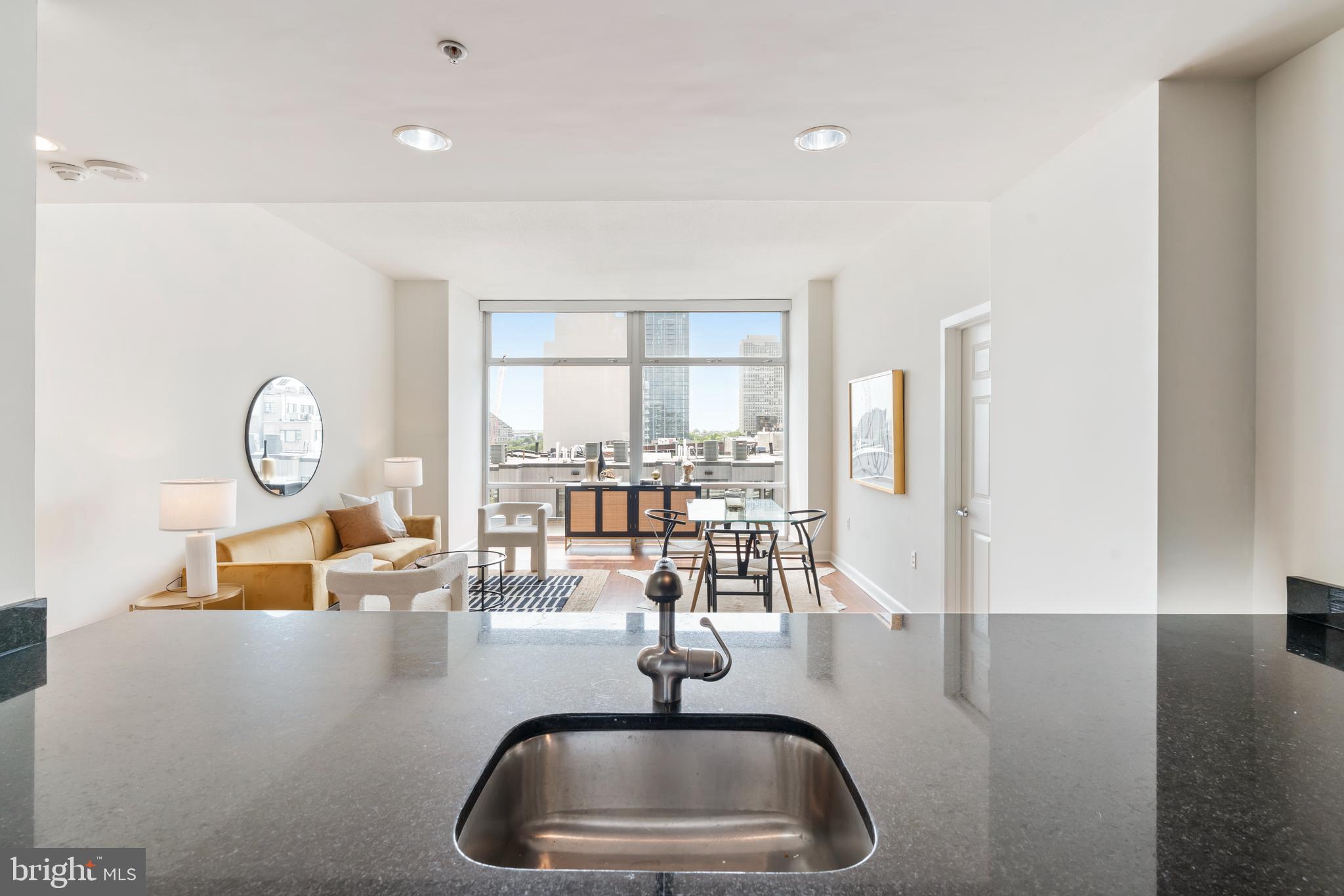 22 South Front Street, Unit 603 Philadelphia, PA 19106 - Photo 13 of 44 a kitchen with counter top space a sink and appliances