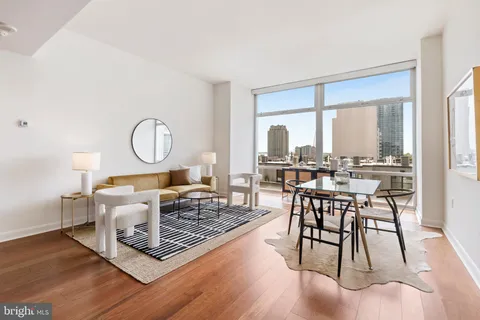 a bedroom with a bed and a lamp