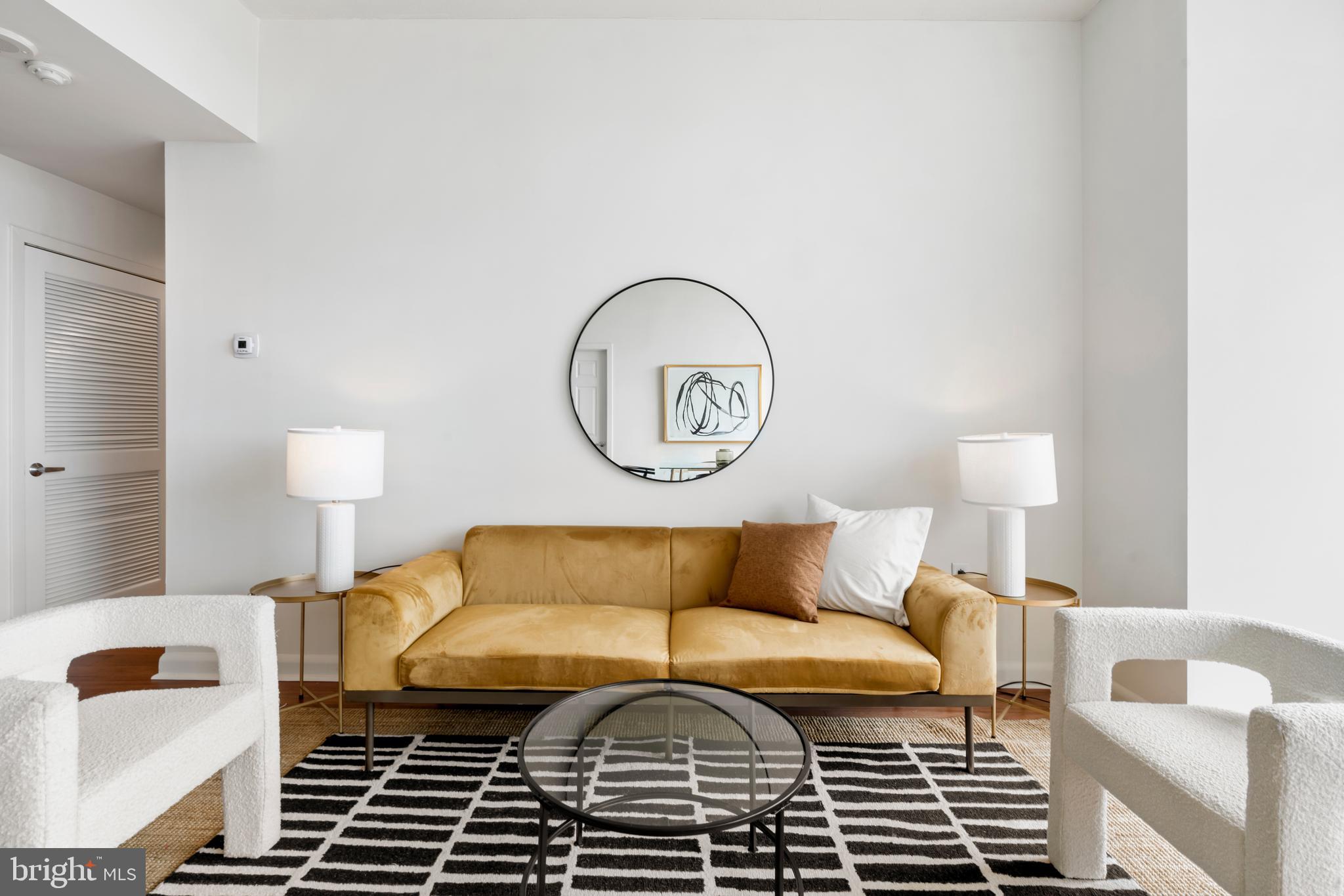 22 South Front Street, Unit 603 Philadelphia, PA 19106 - Photo 18 of 44 a bedroom with a bed and a lamp