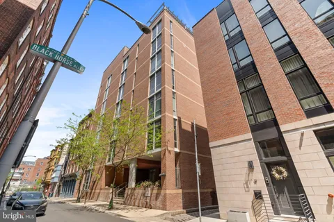 a view of a building with a street
