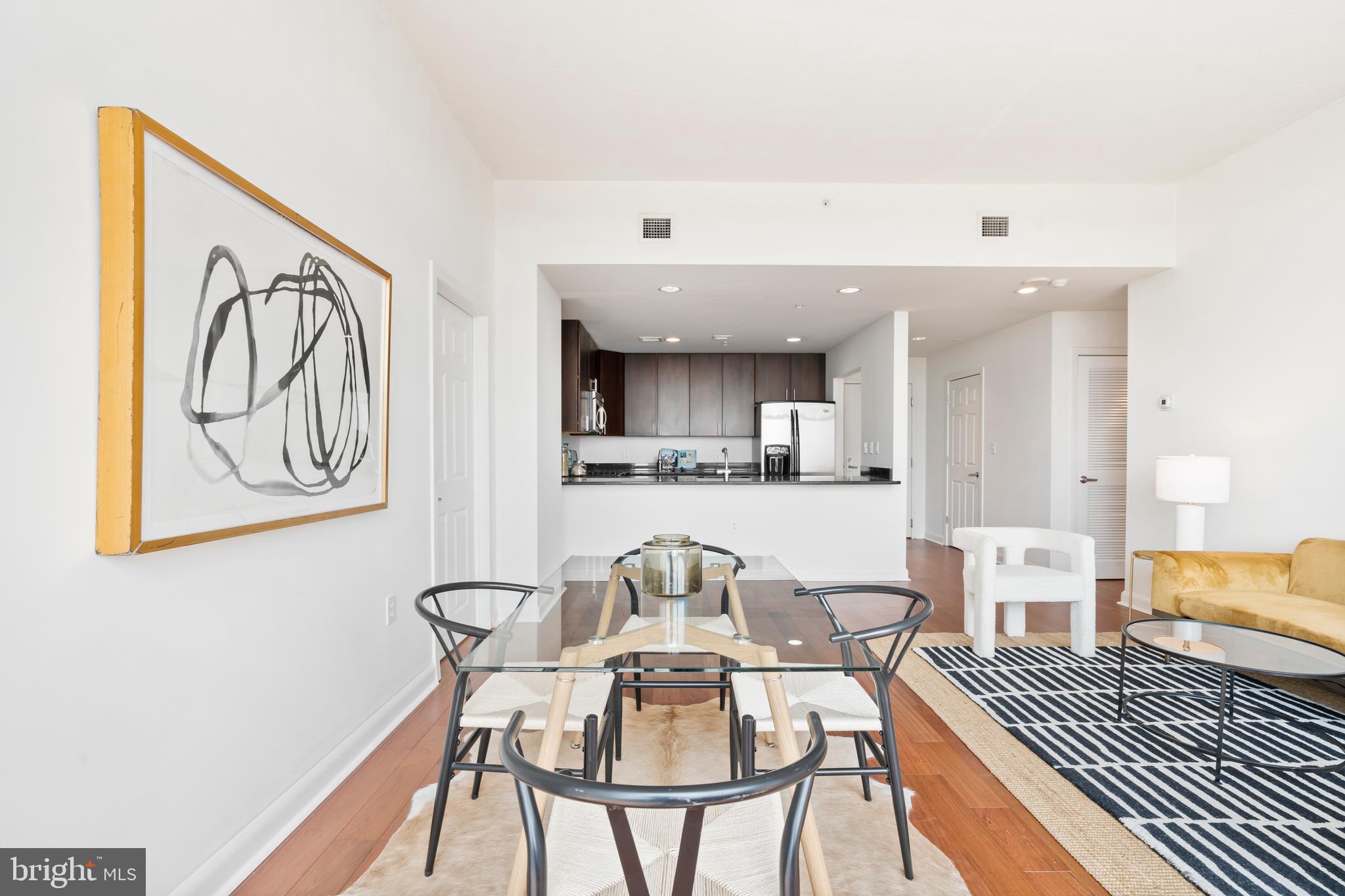 22 South Front Street, Unit 603 Philadelphia, PA 19106 - Photo 24 of 44 a living room with furniture and wooden floor