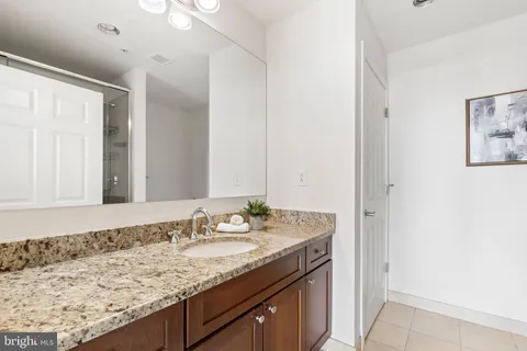 a view of a balcony with wooden floor and fence