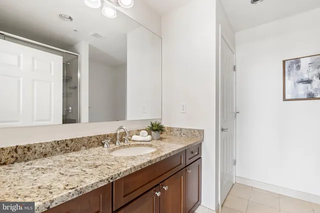 a view of a balcony with wooden floor and fence