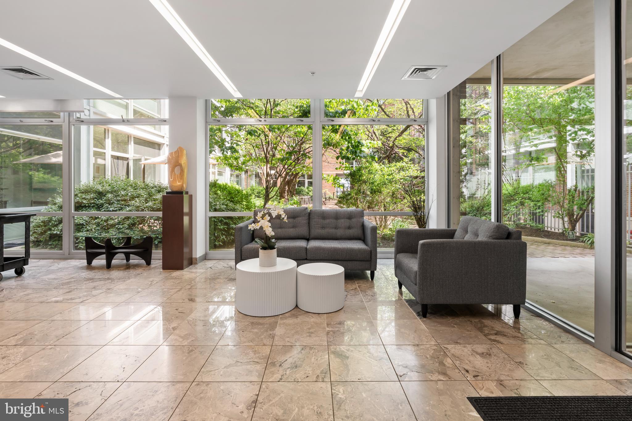 22 South Front Street, Unit 603 Philadelphia, PA 19106 - Photo 4 of 44 a living room with furniture and a large window