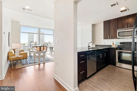a kitchen with a stove and a refrigerator