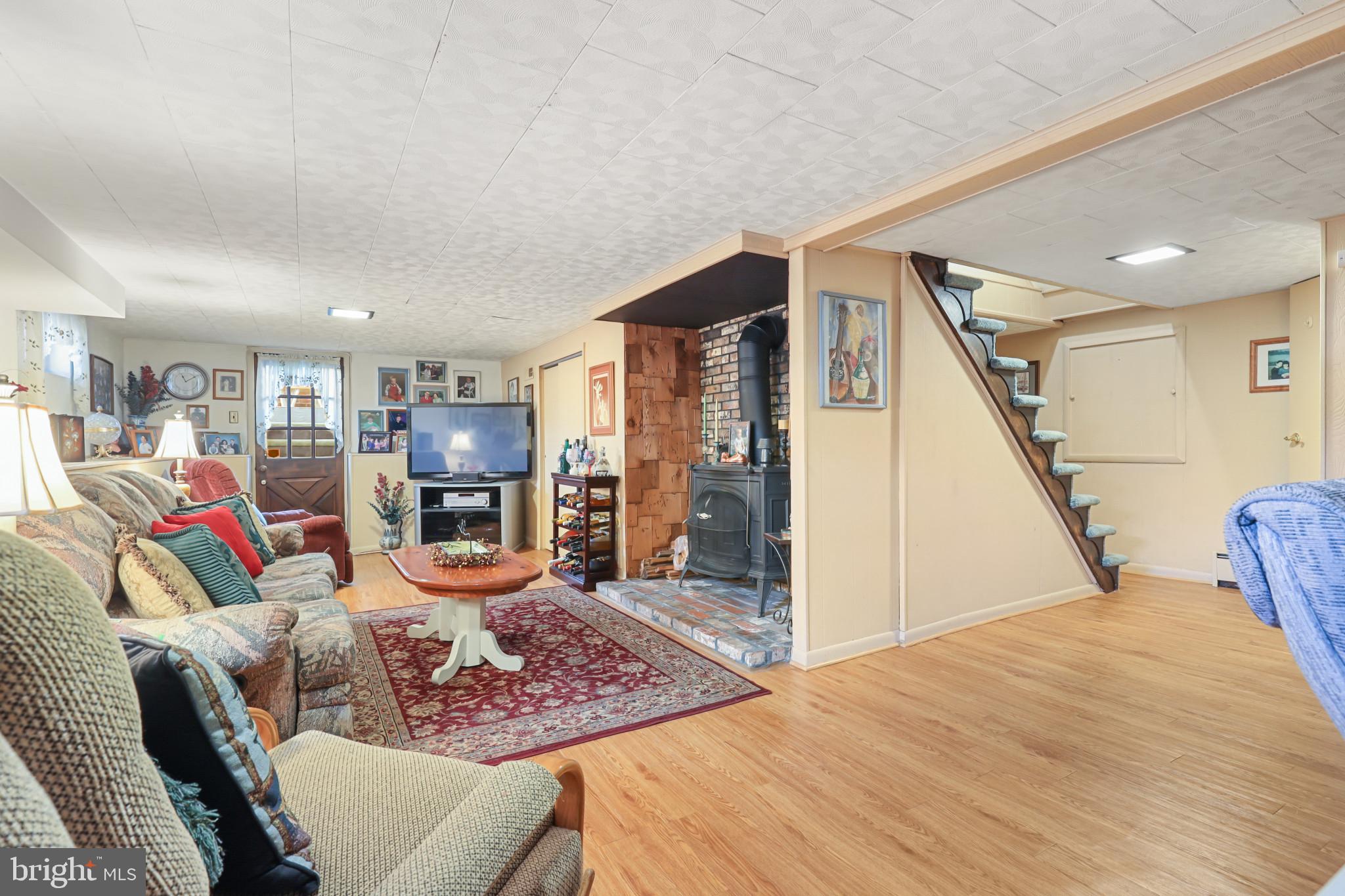 1300 Willow Road Dundalk, MD 21222 - Photo 34 of 36 a living room with furniture and wooden floor