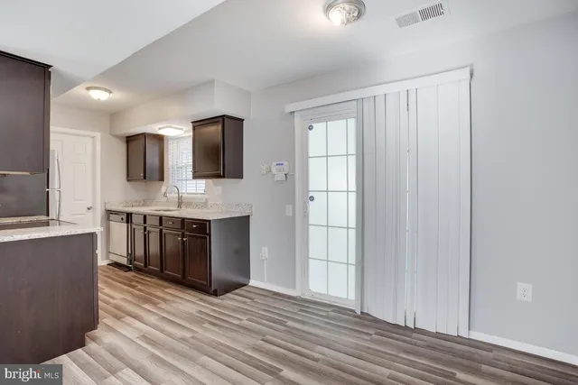 a spacious bathroom with a double vanity sink and a mirror