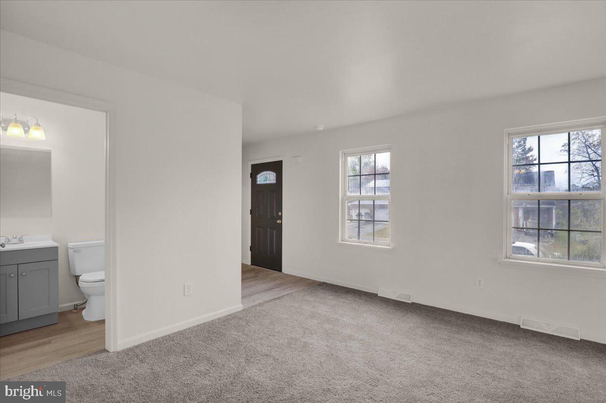 407 Groffdale Road Quarryville, PA 17566 - Photo 6 of 29 a view of an empty room with a window