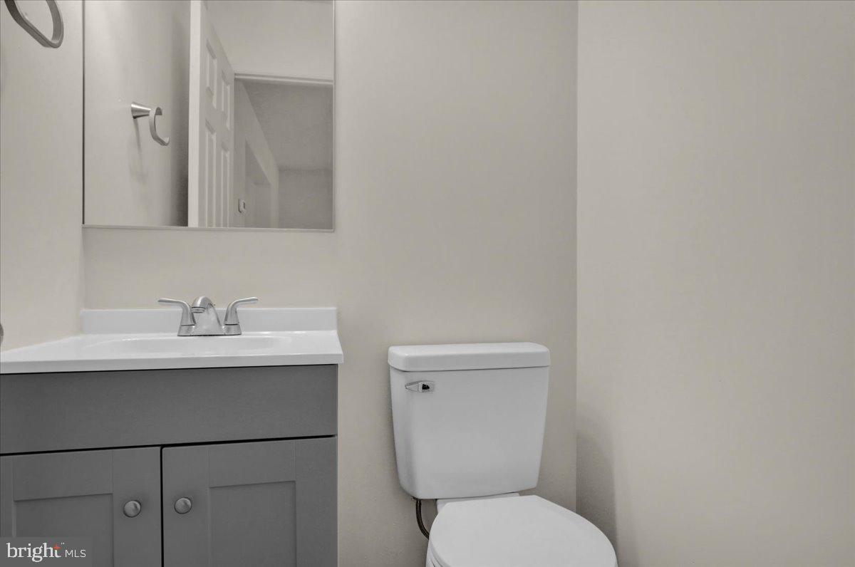 407 Groffdale Road Quarryville, PA 17566 - Photo 7 of 29 a bathroom with a toilet a sink and mirror