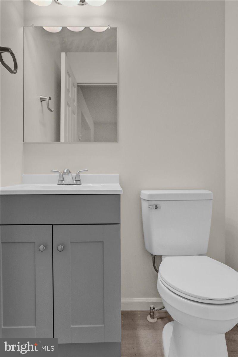 407 Groffdale Road Quarryville, PA 17566 - Photo 8 of 29 a bathroom with a toilet a sink and mirror