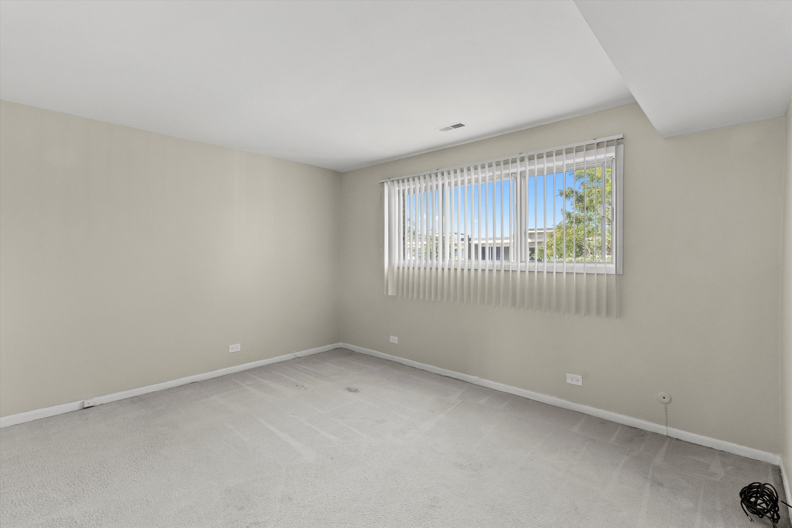 10124 Peach Parkway, Unit 208 Skokie, IL 60076 - Photo 17 of 38 an empty room with a window