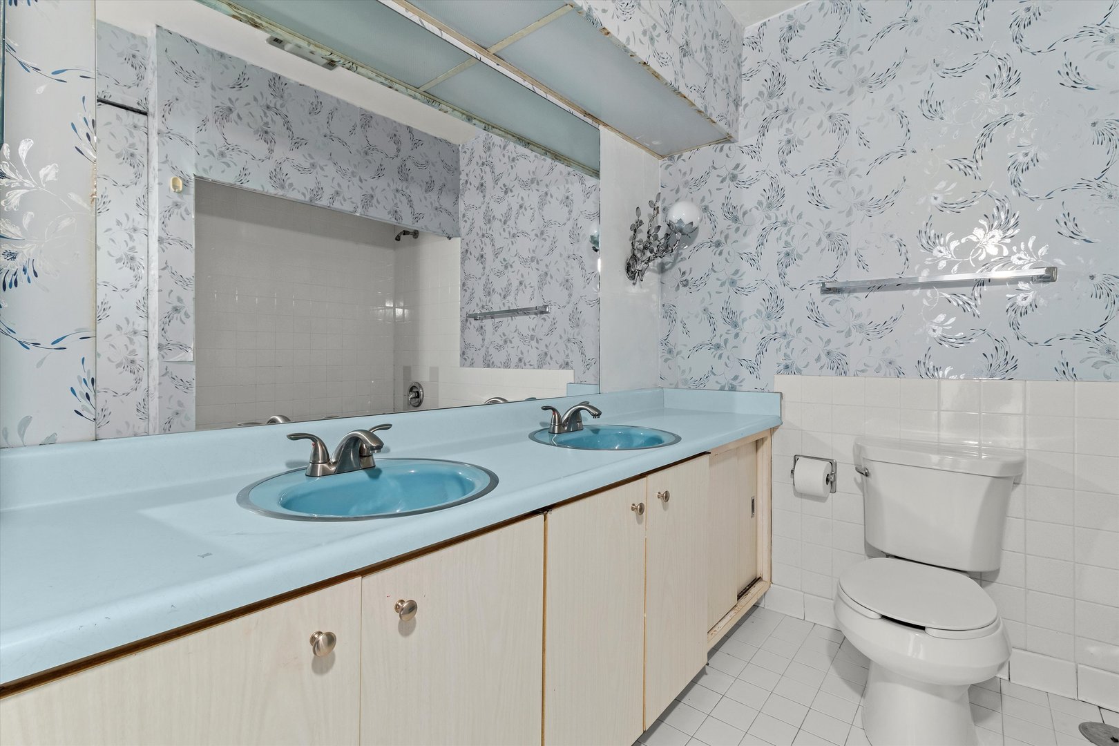 10124 Peach Parkway, Unit 208 Skokie, IL 60076 - Photo 22 of 38 a bathroom with a granite countertop sink toilet and shower