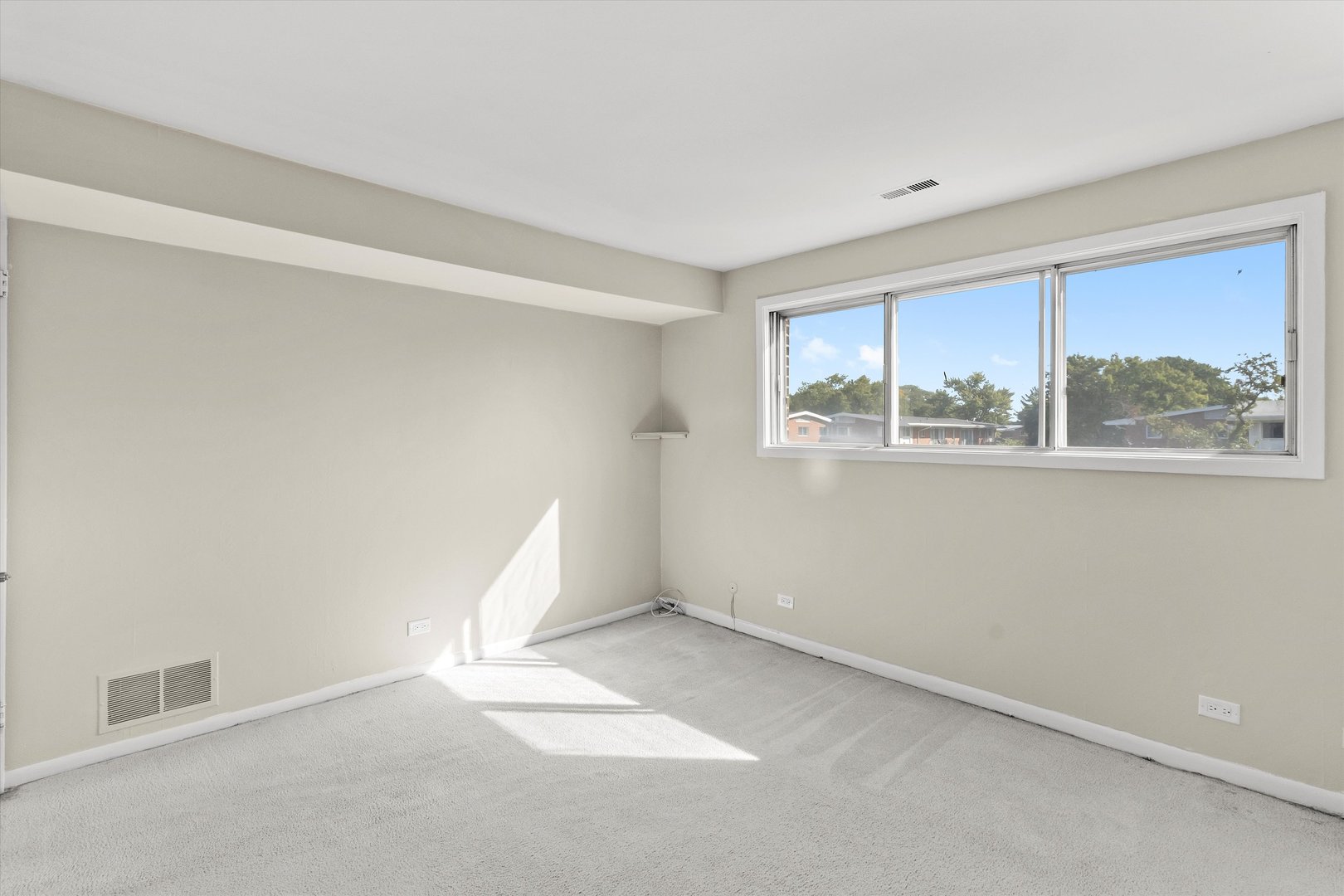 10124 Peach Parkway, Unit 208 Skokie, IL 60076 - Photo 24 of 38 an empty room with windows