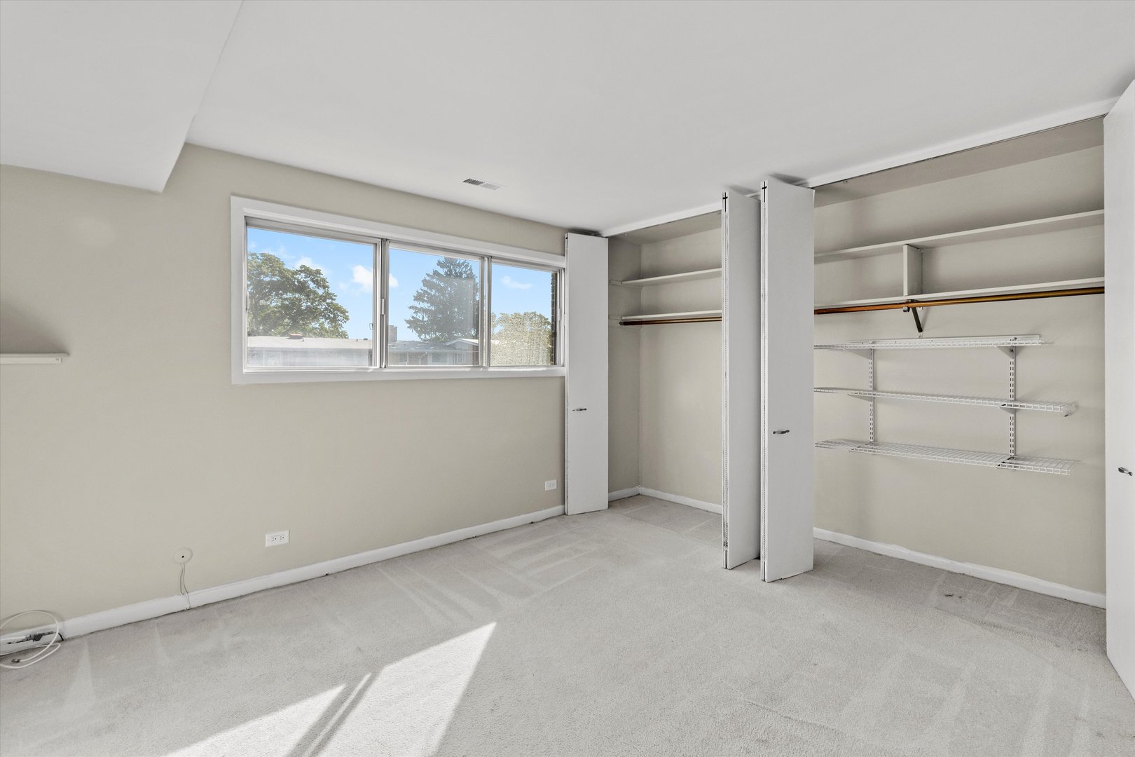 10124 Peach Parkway, Unit 208 Skokie, IL 60076 - Photo 26 of 38 a view of an empty room with a window