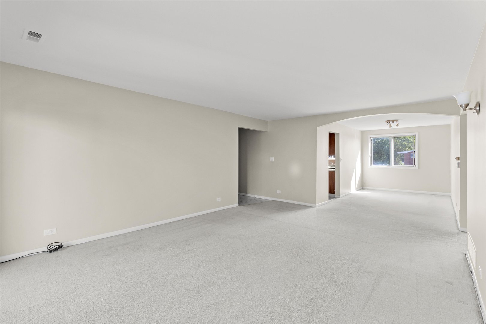 10124 Peach Parkway, Unit 208 Skokie, IL 60076 - Photo 8 of 38 a view of an empty room with a window