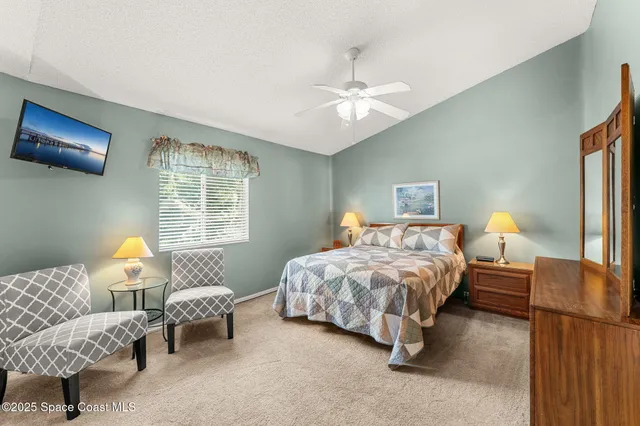 a bedroom with bed and window