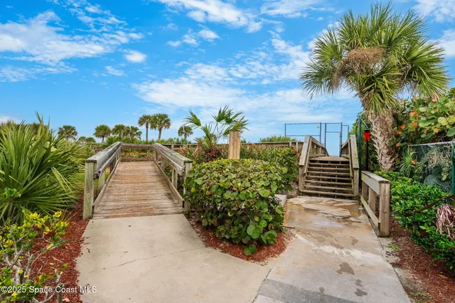 a view of a pathway with a yard