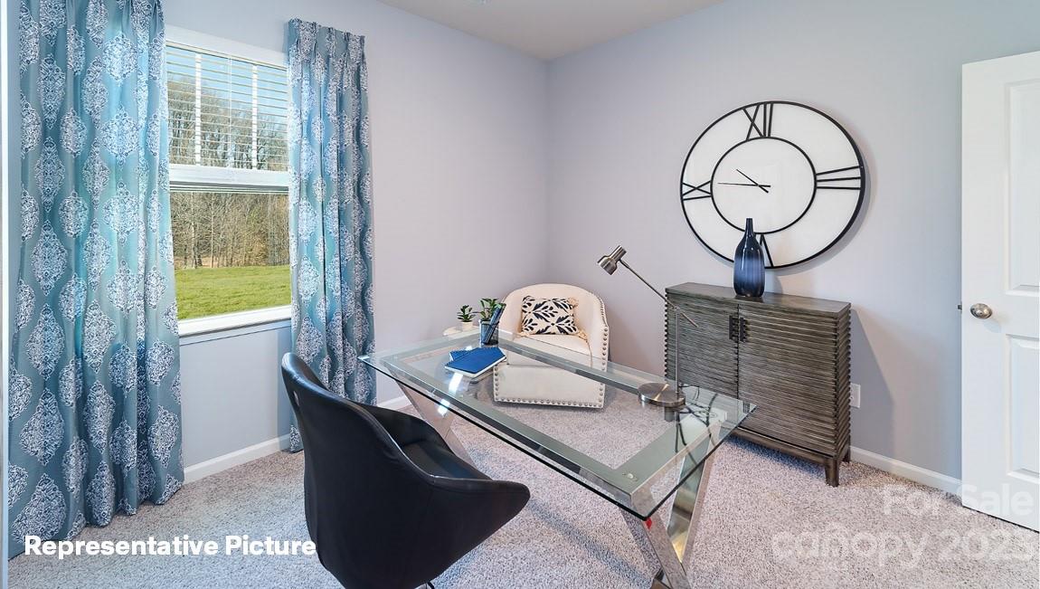3791 Charles Street Northwest Conover, NC 28613 - Photo 20 of 32 a living room with furniture and a window