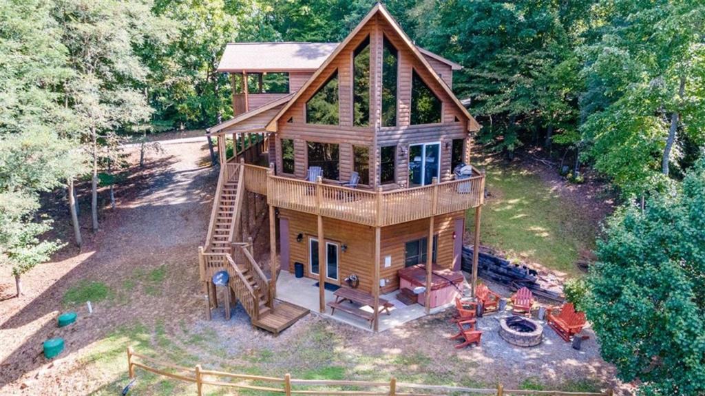 192 Oak Ridge Way Morganton, GA 30560 - Photo 1 of 56 a front view of a house with garden