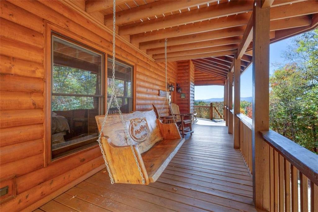 192 Oak Ridge Way Morganton, GA 30560 - Photo 2 of 56 a outdoor space with wooden floor and outdoor seating