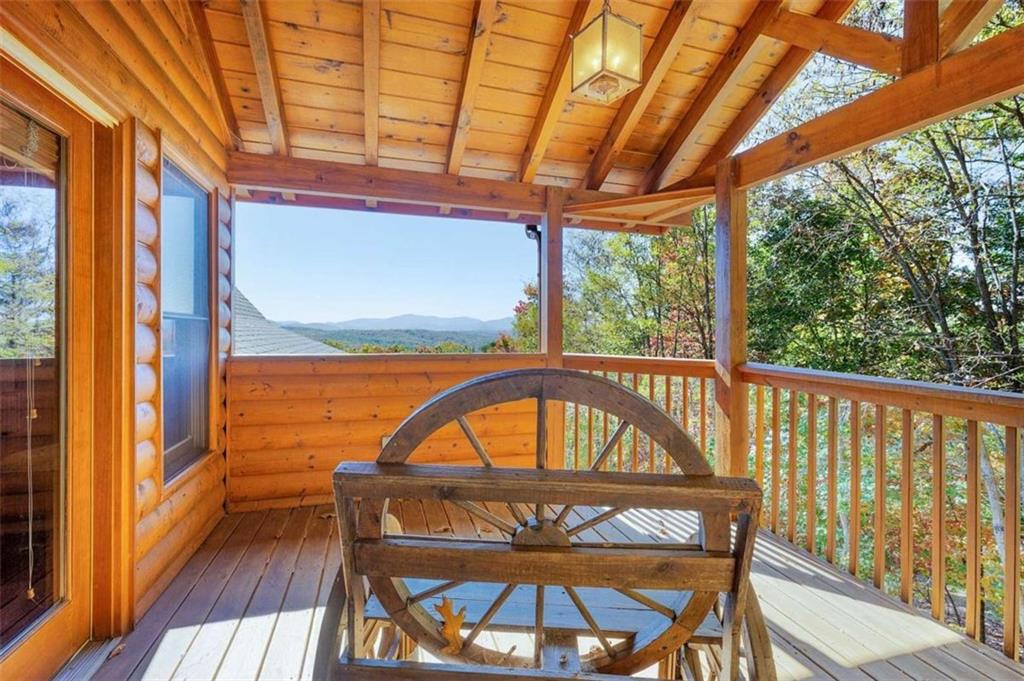 192 Oak Ridge Way Morganton, GA 30560 - Photo 26 of 56 a view of a balcony with furniture and wooden floor