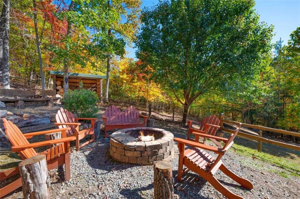 192 Oak Ridge Way Morganton, GA 30560 - Photo 28 of 56 a view of an outdoor sitting area with brick walls
