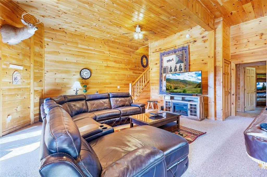 192 Oak Ridge Way Morganton, GA 30560 - Photo 52 of 56 a living room with furniture and a flat screen tv