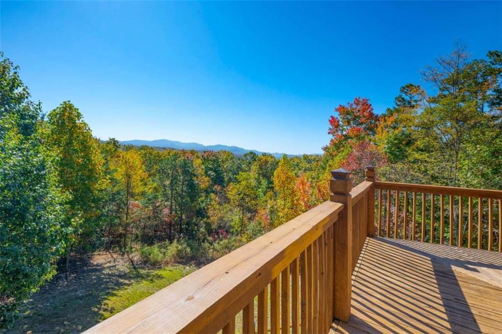 192 Oak Ridge Way Morganton, GA 30560 - Photo 7 of 56 a view of a balcony with wooden fence