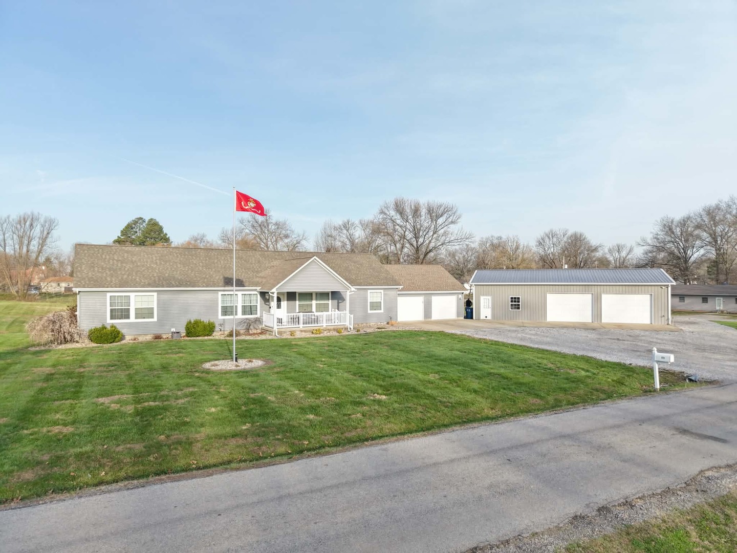 513 North 10th Street Benton, IL 62812 - Photo 14 of 75 a front view of a house with a yard and garage