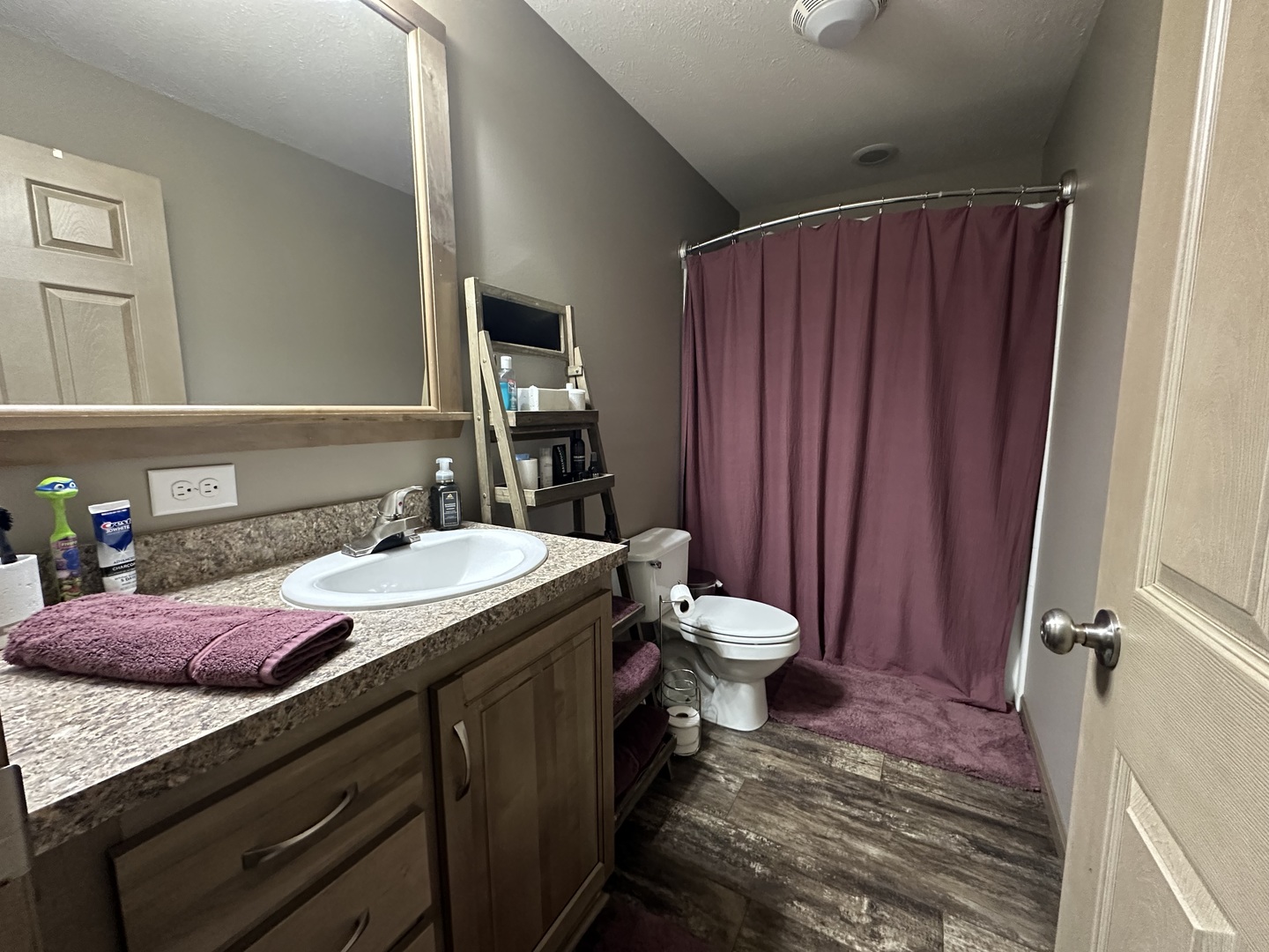513 North 10th Street Benton, IL 62812 - Photo 65 of 75 a bathroom with a sink and a toilet