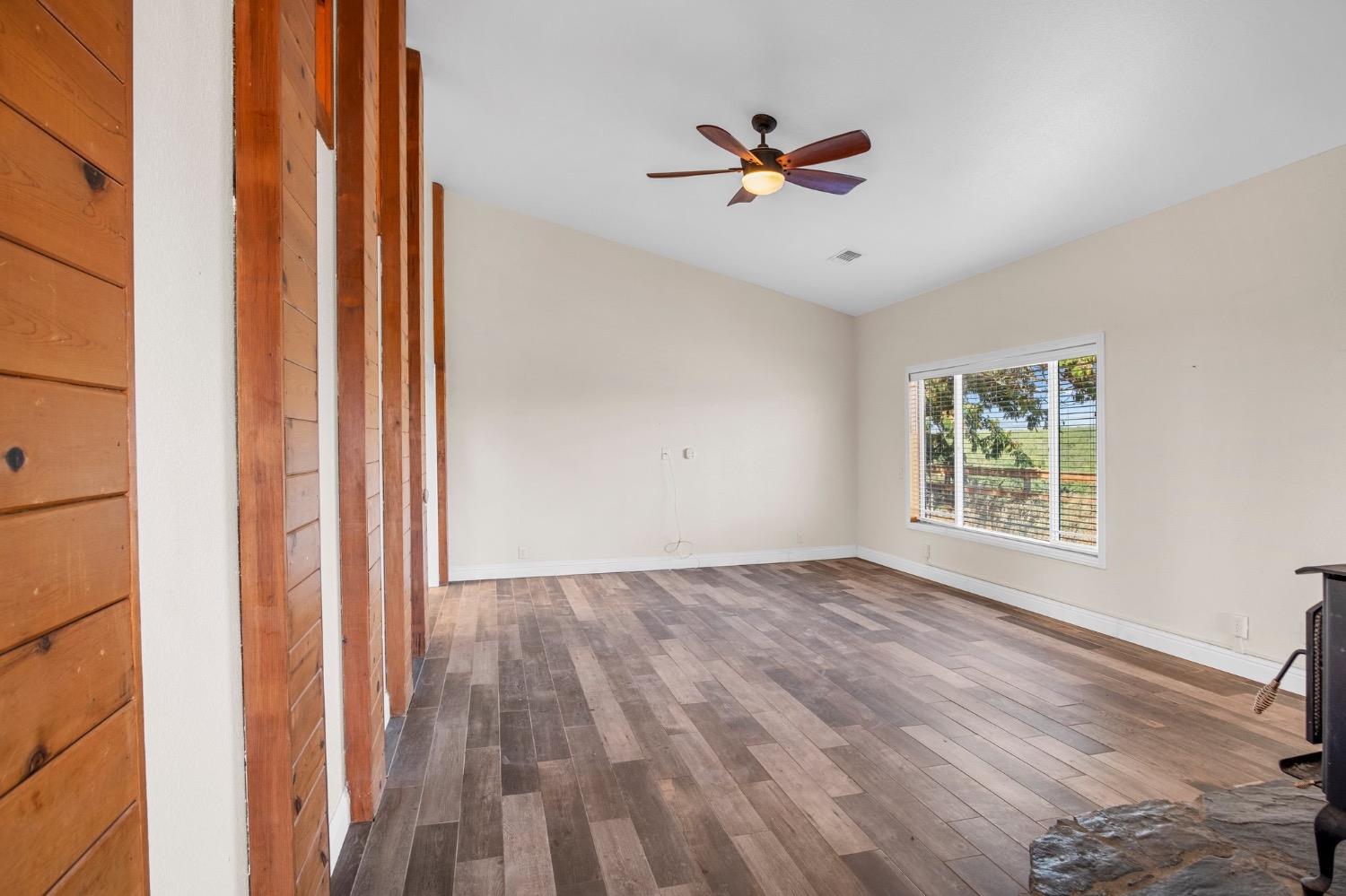 17164 Keyes Road Snelling, CA 95369 - Photo 22 of 51 wooden floor in an empty room with a window