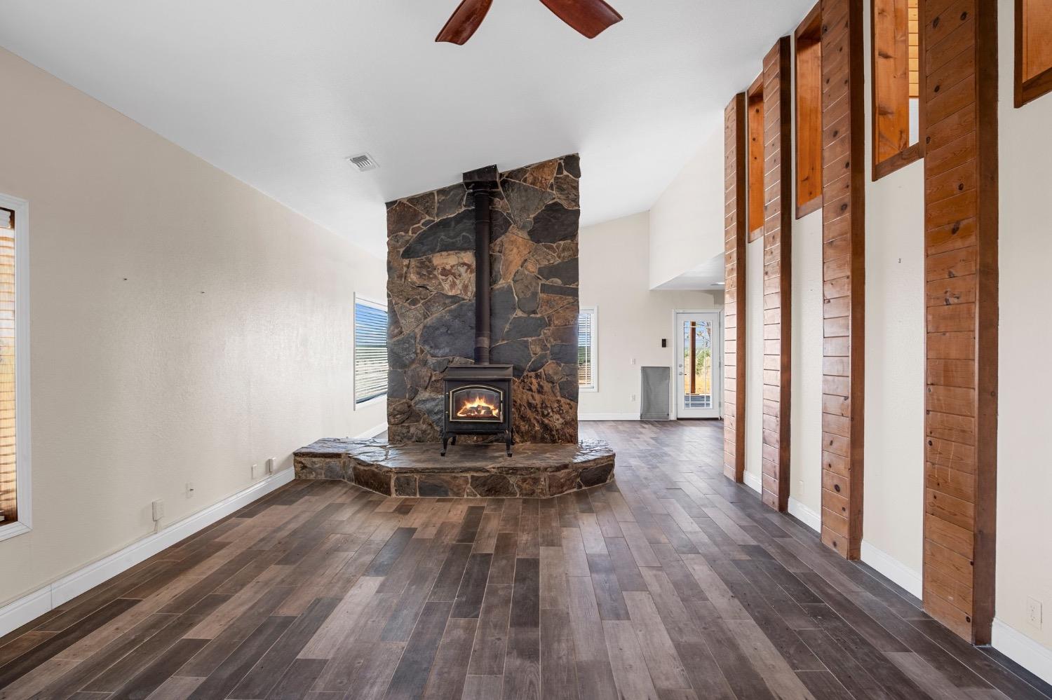 17164 Keyes Road Snelling, CA 95369 - Photo 23 of 51 a living room with furniture and a floor to ceiling window