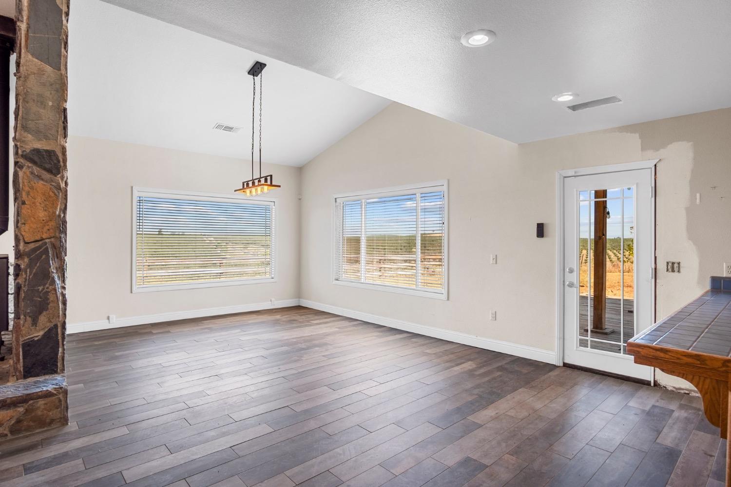 17164 Keyes Road Snelling, CA 95369 - Photo 24 of 51 a view of an empty room with a window and wooden floor