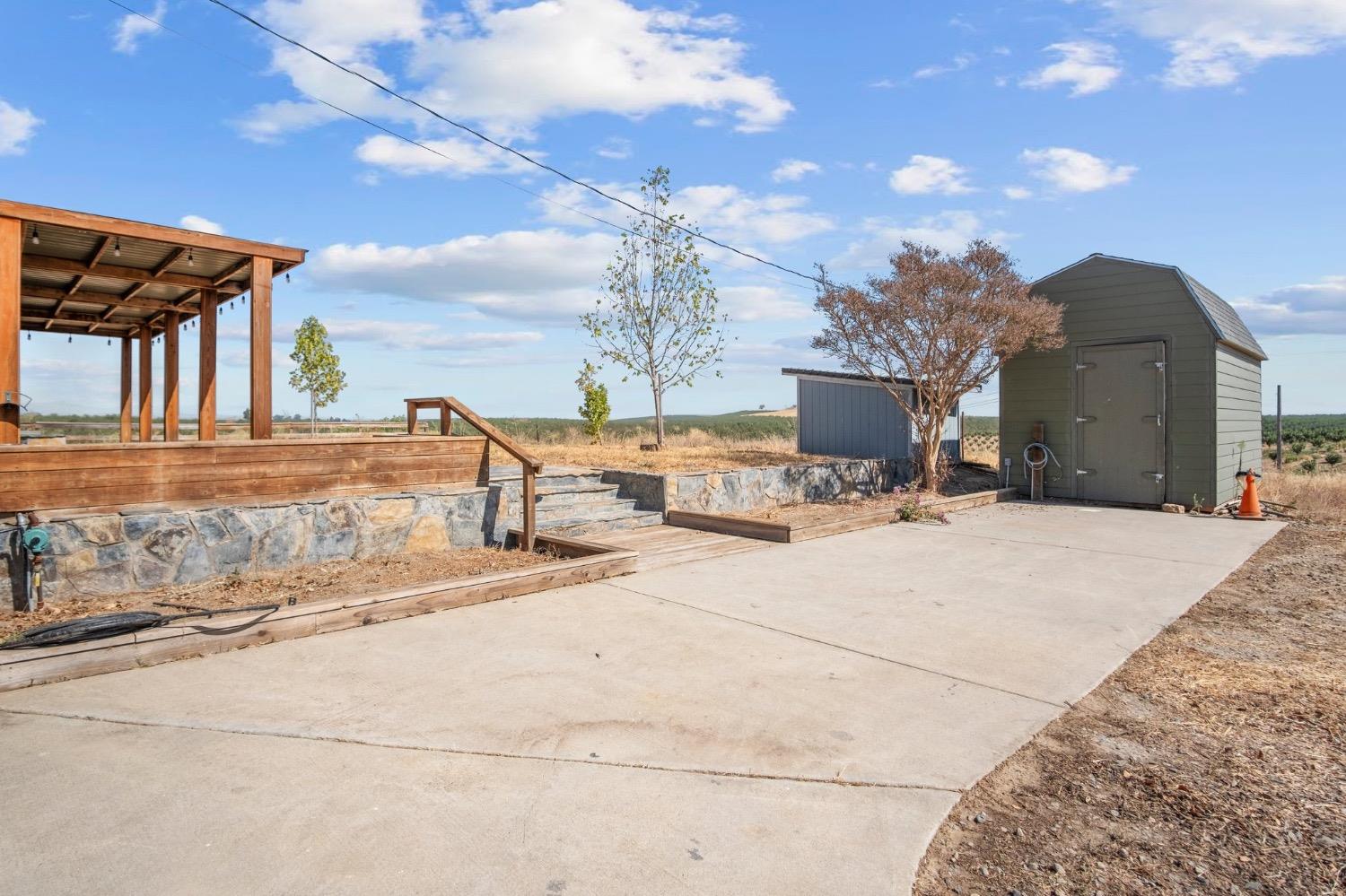 17164 Keyes Road Snelling, CA 95369 - Photo 29 of 51 a view of a terrace with a bench
