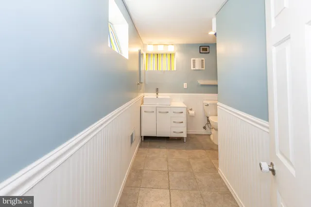 a bathroom with a sink a mirror and a bathtub