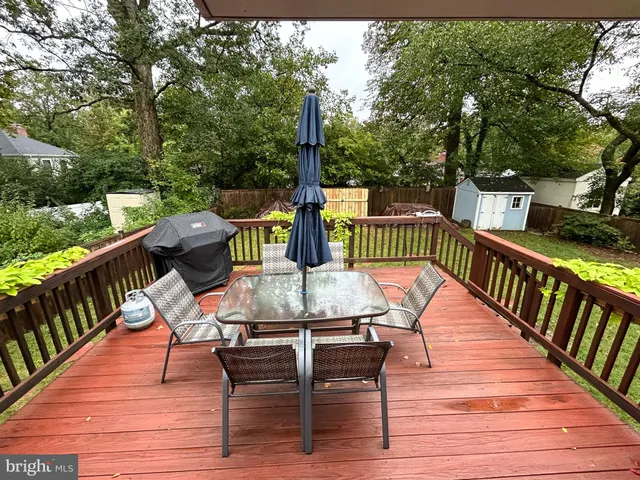 a view of balcony with furniture and trees