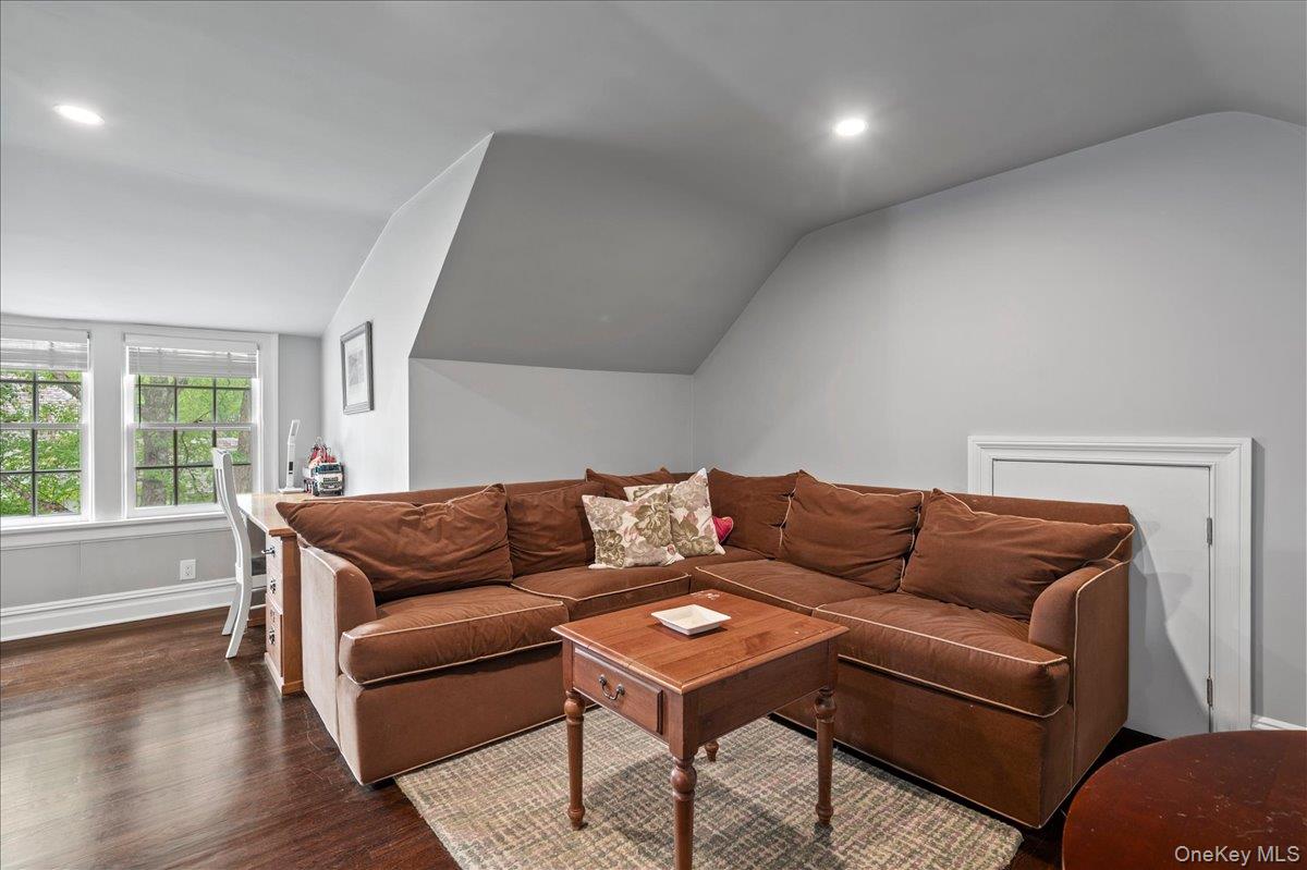 7 Harcourt Road Scarsdale, NY 10583 - Photo 24 of 34 a living room with a couch and a window