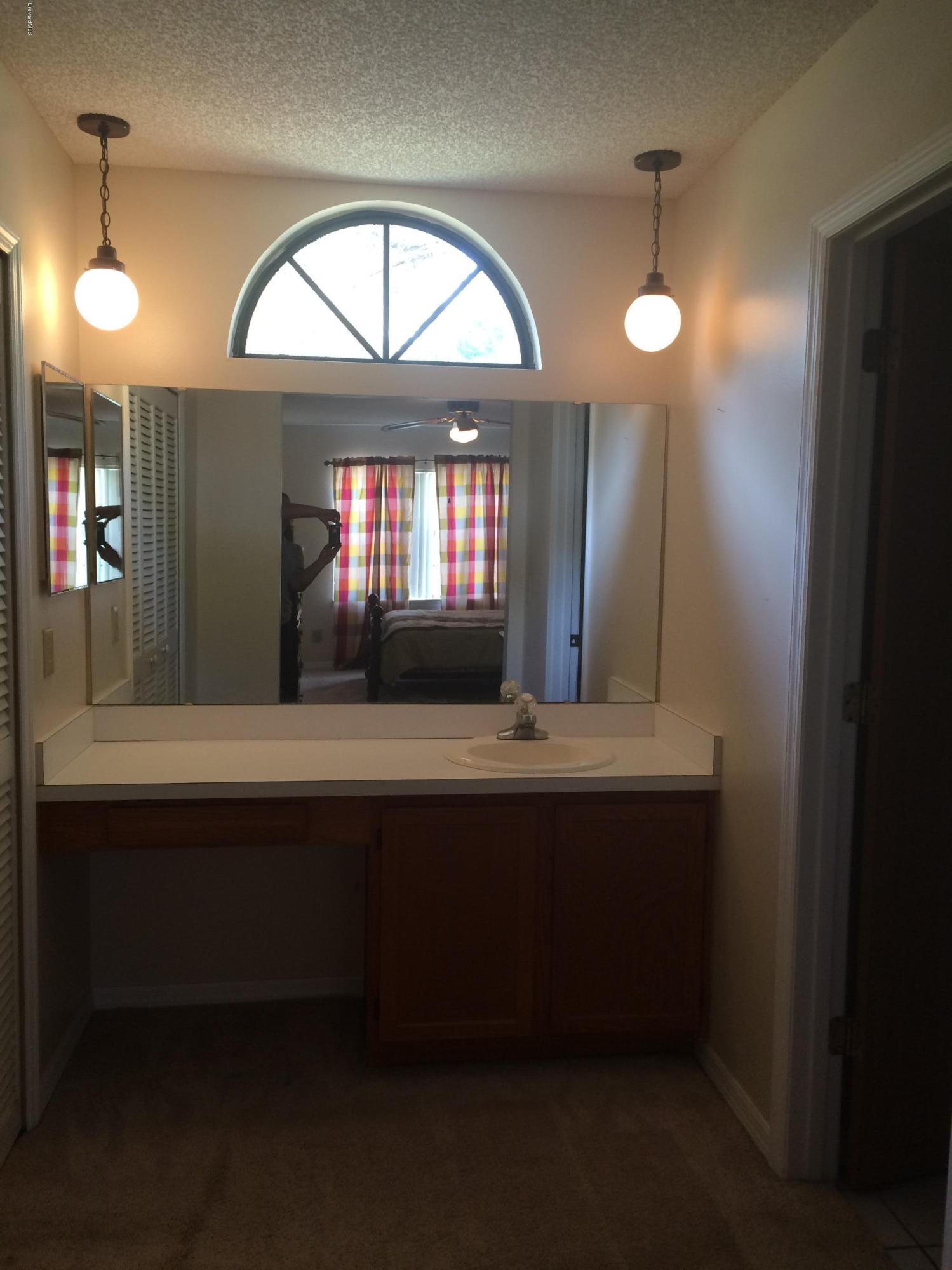 1749 Tharp Road Palm Bay, FL 32909 - Photo 19 of 34 Master Bedroom/Bathroom