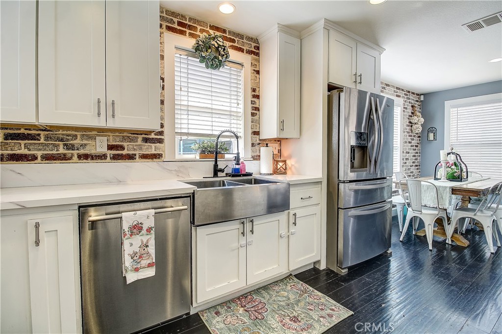 3533 Millhouse Court Riverside, CA 92503 - Photo 15 of 37 a kitchen with a refrigerator and a sink
