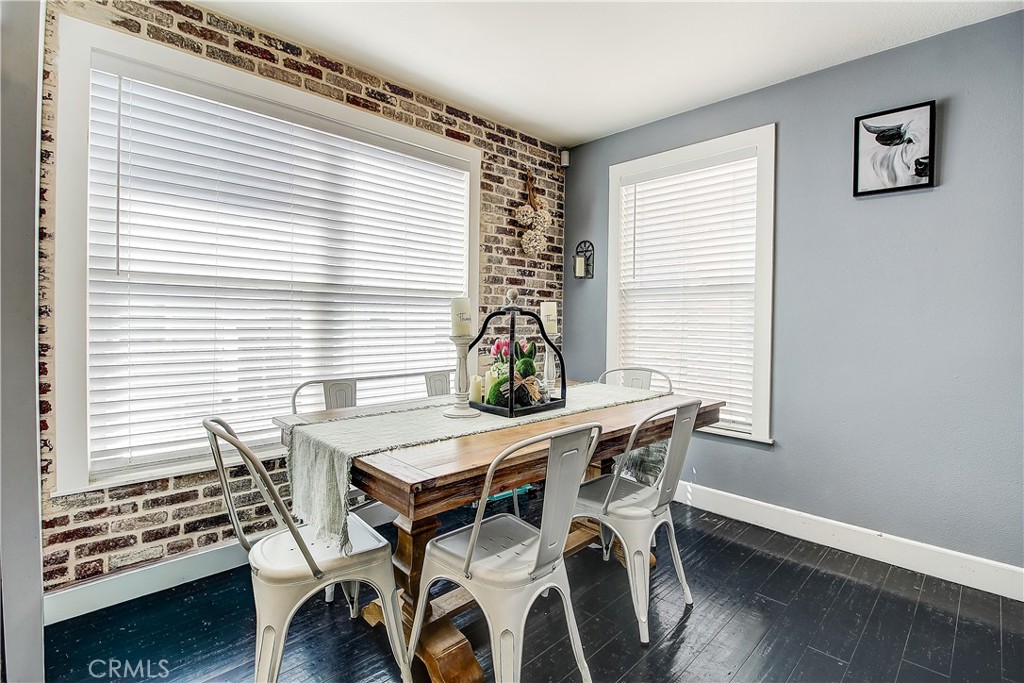 3533 Millhouse Court Riverside, CA 92503 - Photo 16 of 37 a view of a dining room with furniture and wooden floor