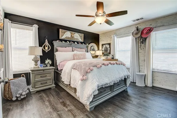 a bed room with a bed and a chandelier