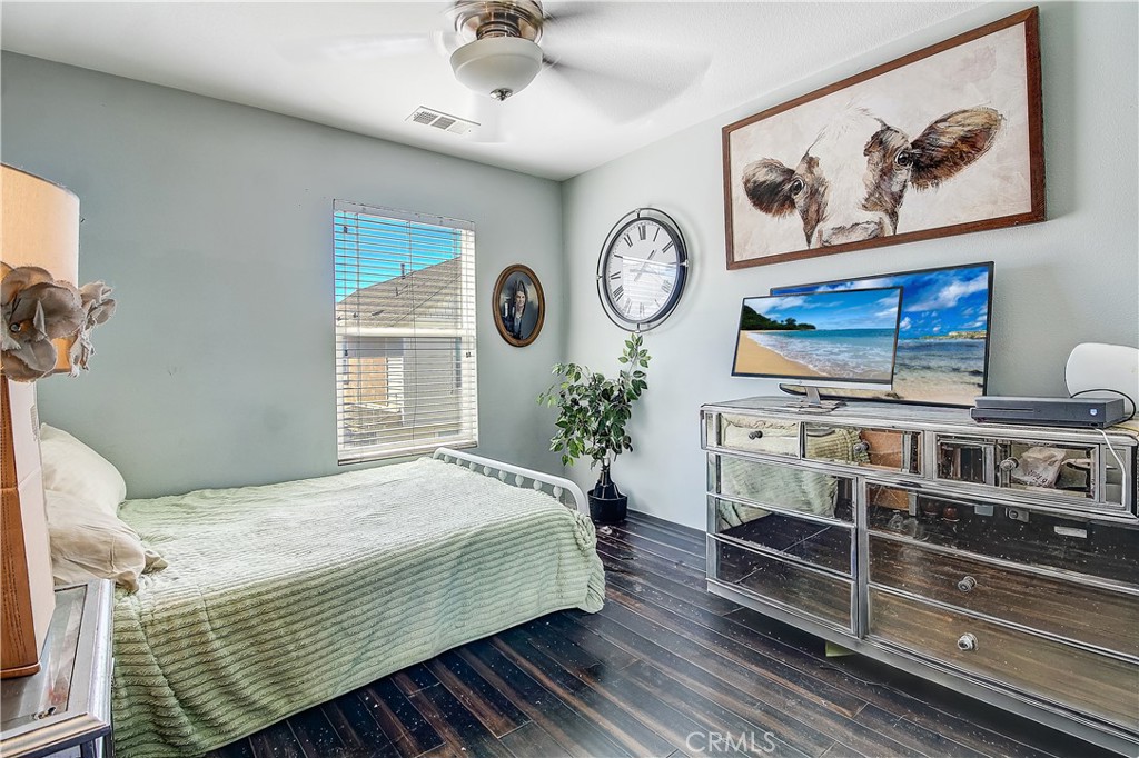 3533 Millhouse Court Riverside, CA 92503 - Photo 26 of 37 a bedroom with a bed and painting on the wall