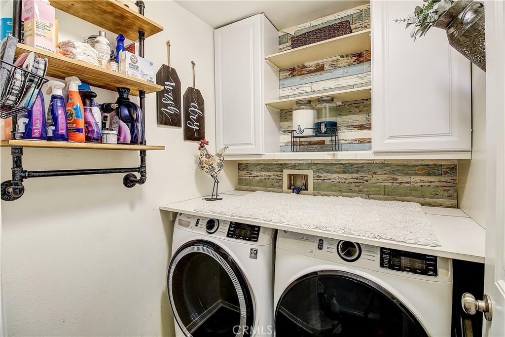 3533 Millhouse Court Riverside, CA 92503 - Photo 28 of 37 a view of storage and utility room with washer and dryer