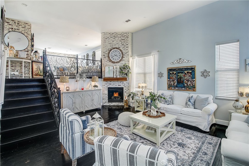 3533 Millhouse Court Riverside, CA 92503 - Photo 4 of 37 a living room with furniture a fireplace and white walls