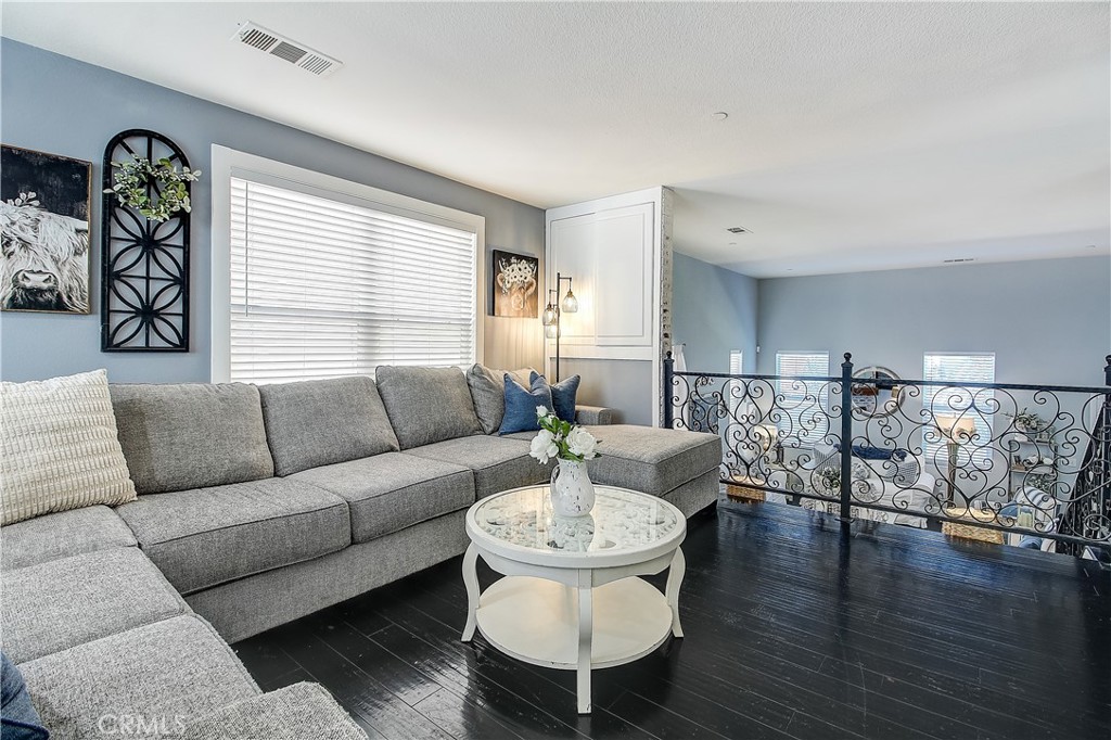 3533 Millhouse Court Riverside, CA 92503 - Photo 10 of 37 a living room with furniture and wooden floor