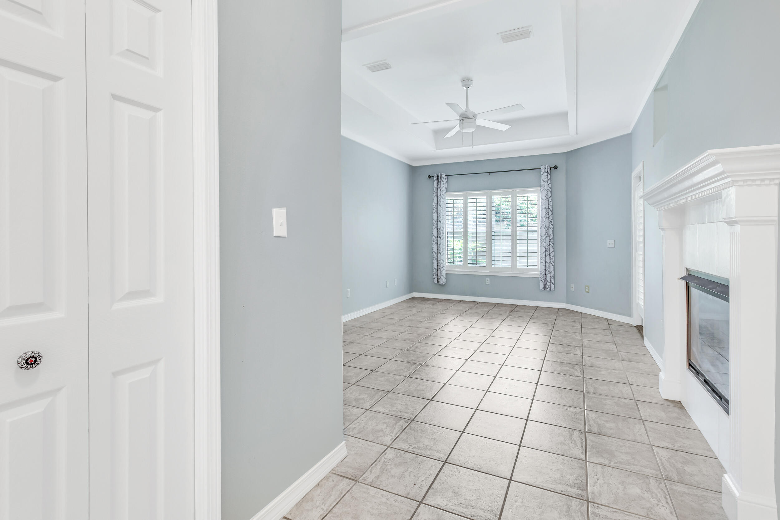 244 Indigo Loop Destin, FL 32550 - Photo 12 of 41 an empty room with windows and fireplace