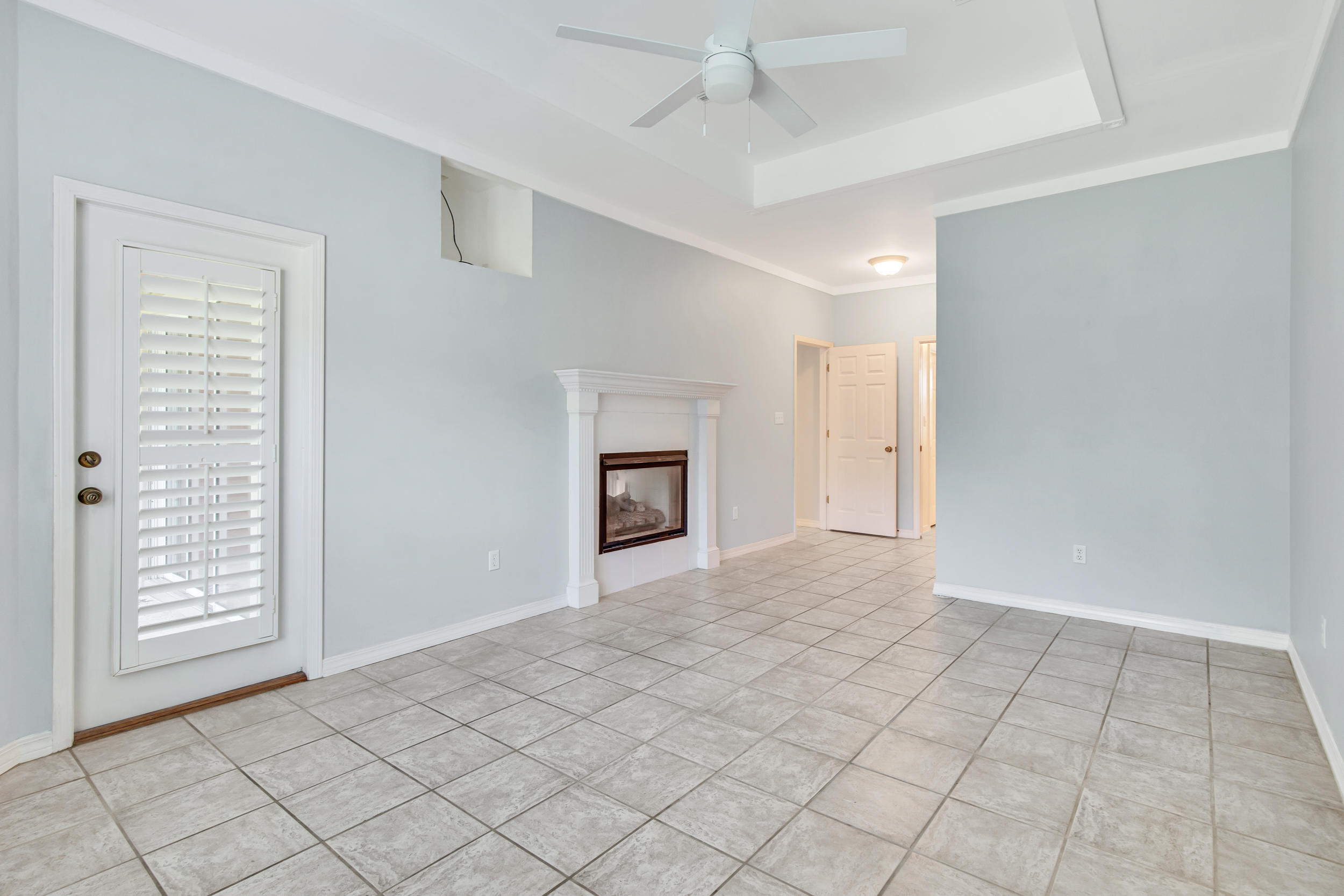 244 Indigo Loop Destin, FL 32550 - Photo 13 of 41 an empty room with windows and fan