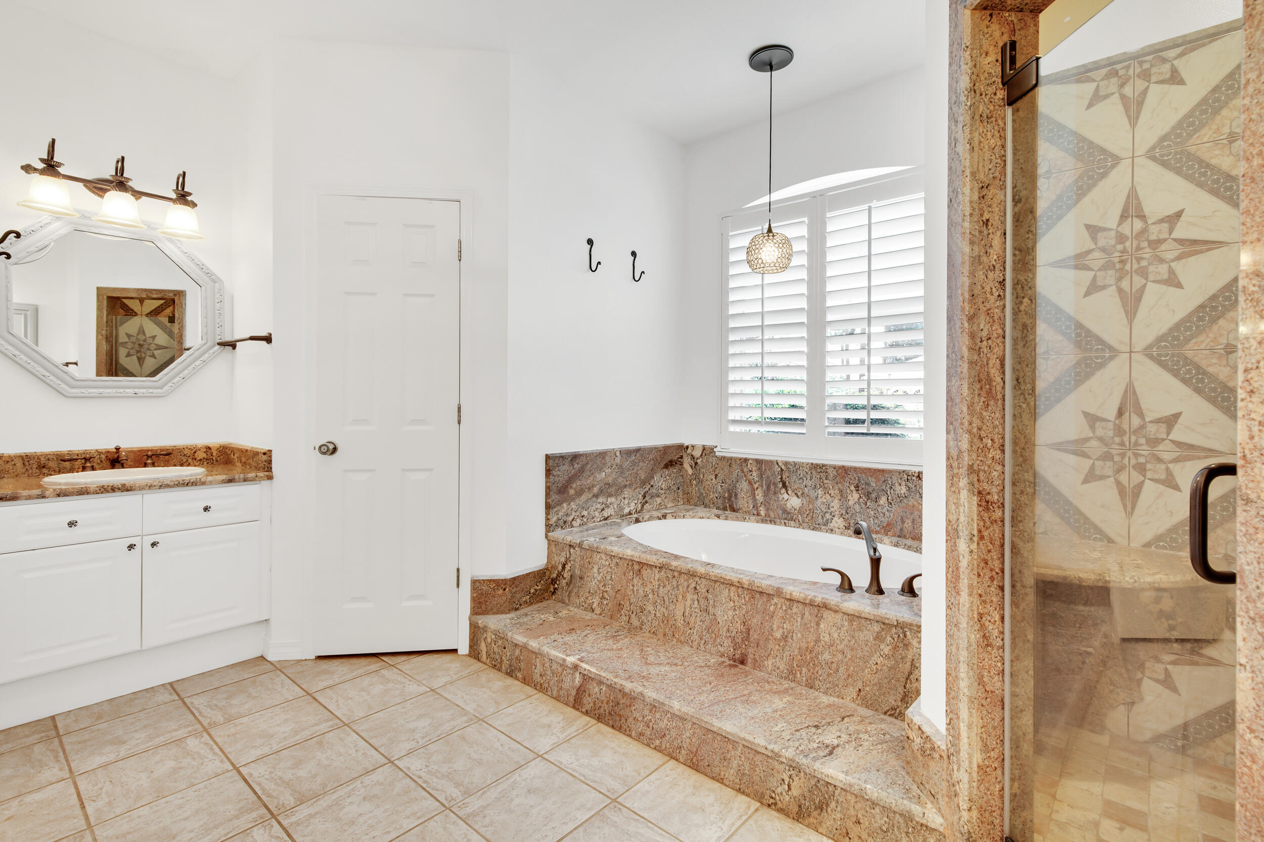 244 Indigo Loop Destin, FL 32550 - Photo 16 of 41 a bathroom with a bathtub and a shower