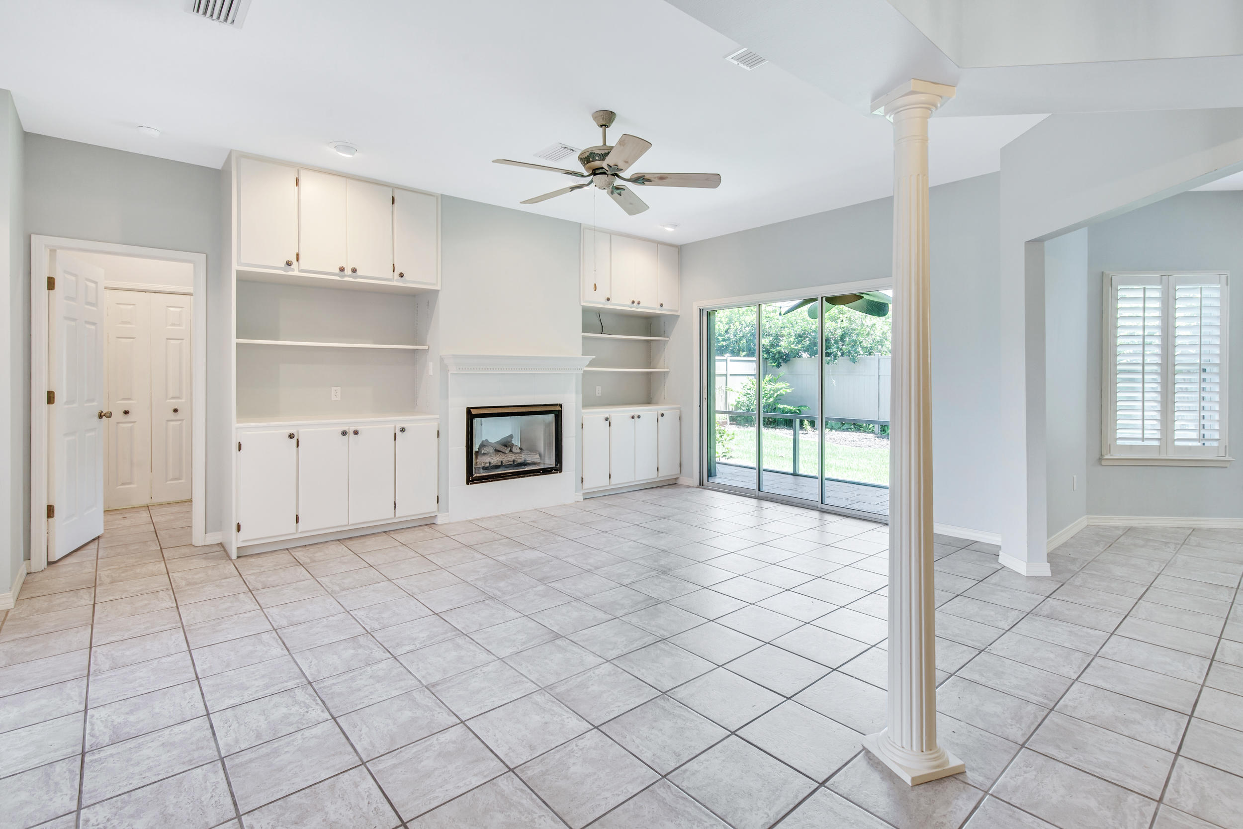 244 Indigo Loop Destin, FL 32550 - Photo 3 of 41 an empty room with fireplace and windows