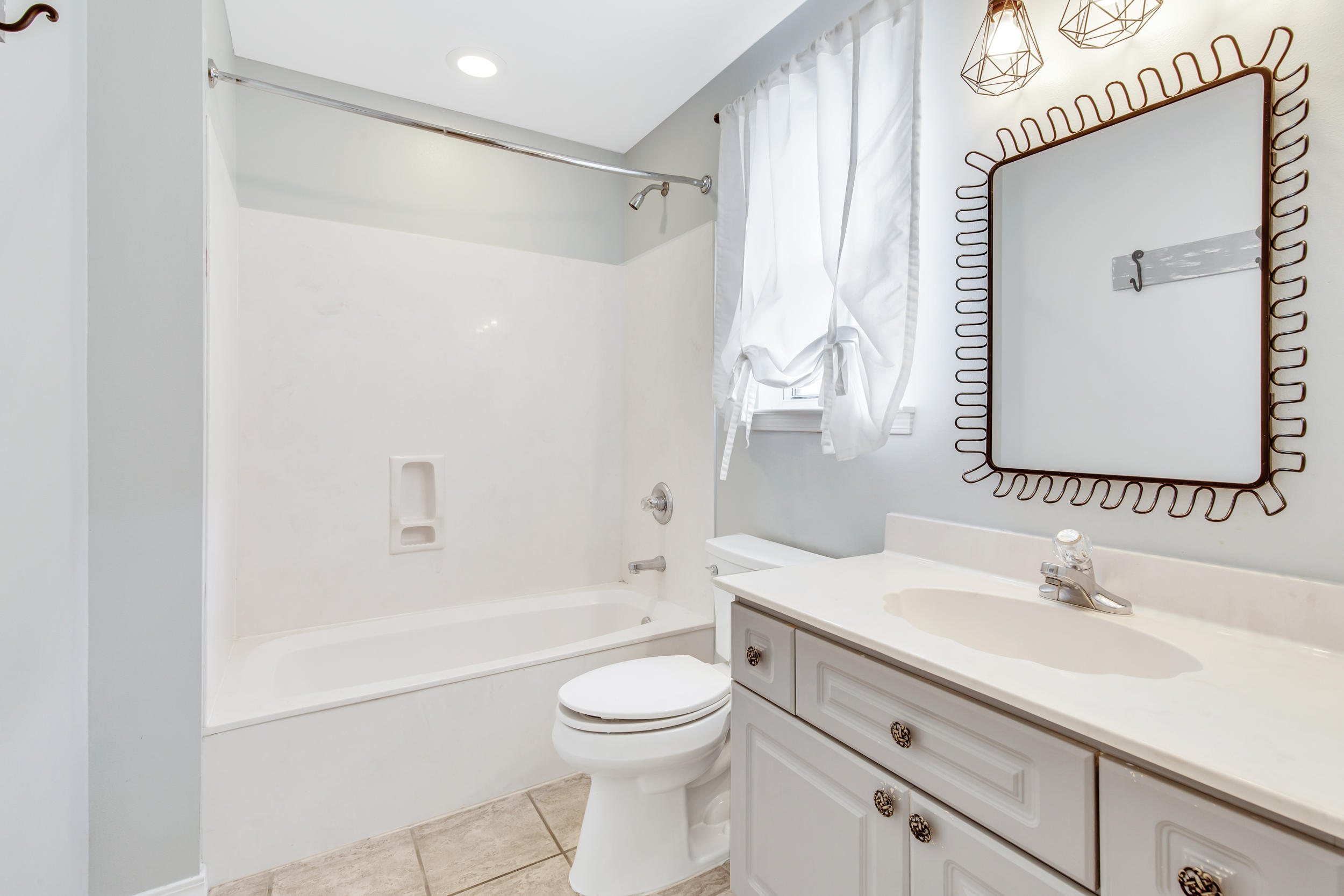 244 Indigo Loop Destin, FL 32550 - Photo 25 of 41 a bathroom with a sink a toilet and shower